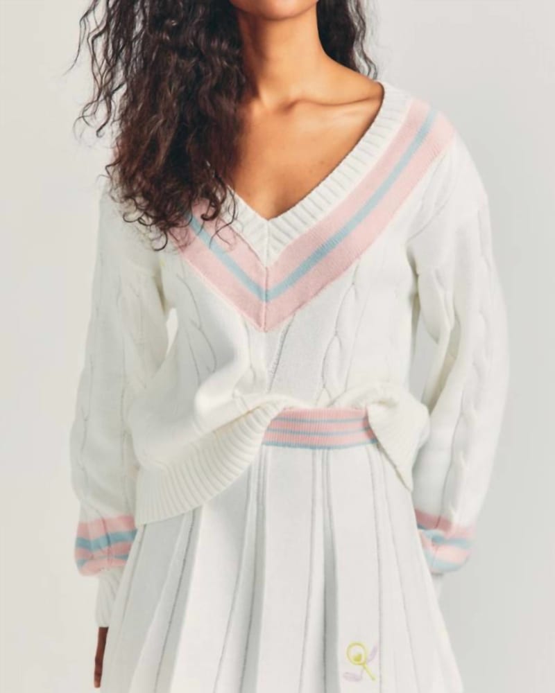 Front of a model wearing a size L Roz Skirt in Tennis Whites in Tennis Whites by LoveShackFancy. | dia_product_style_image_id:339586